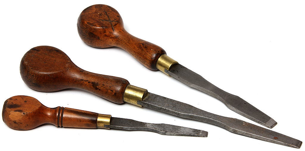 alt="An antique restorer's tools of the trade. Vintage hand made screwdrivers with boxwood handles. Suitable for antique hand made screws."