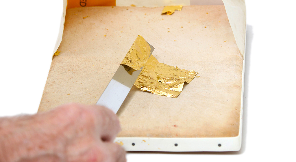 Student learning how to gild using 24 carat gold leaf